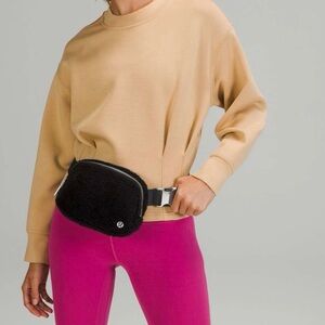 Lululemon Everywhere Fleece Belt Bag, black with silver tone hardware.